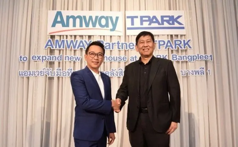 Mr. Kittawat Ritteerawee (left), Managing Director ...