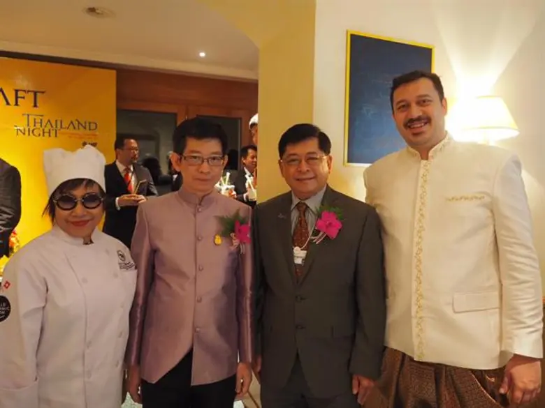 Dr. Kobsak Pootrakool (second from left),...