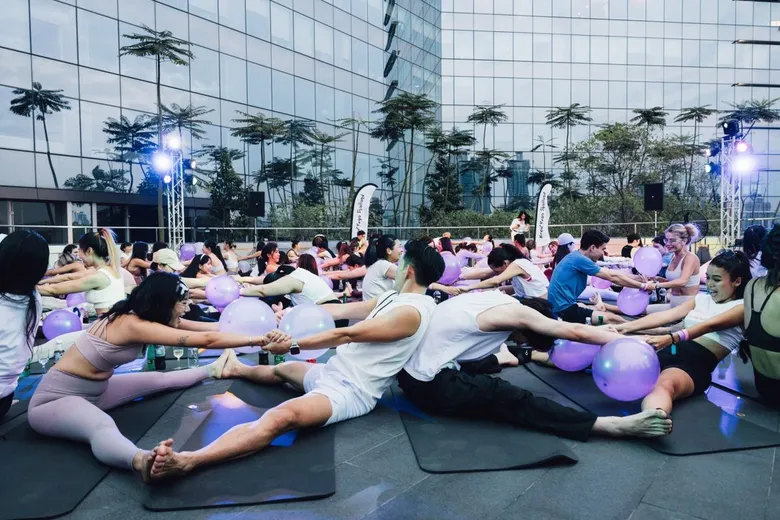SHE RISES: Brew Yoga & Swing Dance Party. Celebrating Women's Strength, Body and Soul in Bangkok's Rooftop Garden at The PARQ.