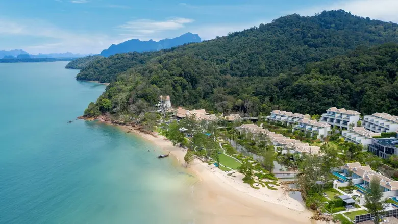 The spectacular limestone cliffs and lush...