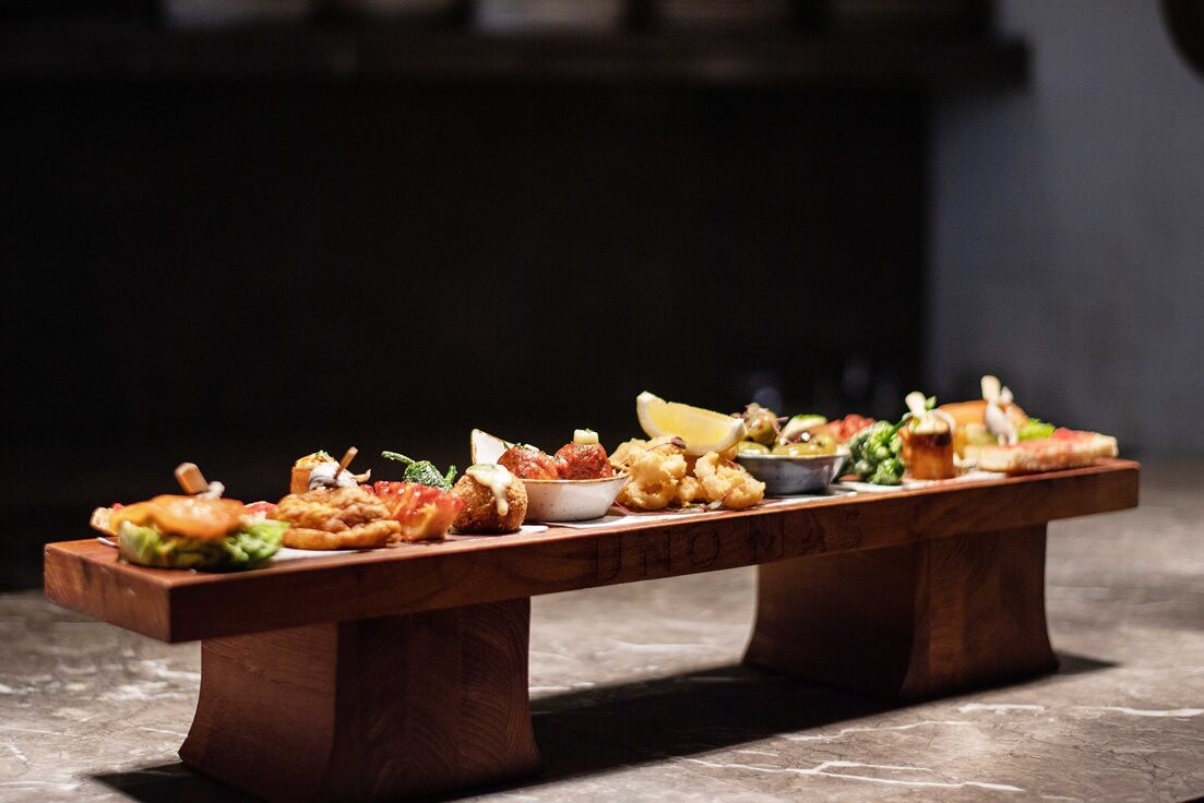 Experience the Best of Spain with UNO MAS's "2 Feet of Tapas" Deal